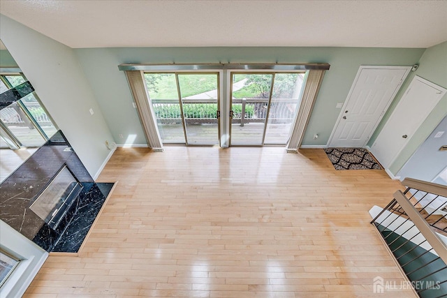 68 Kelly Dr, Edison, NJ 08820 - unfurnished living room featuring wood-type flooring and healthy amount of natural light