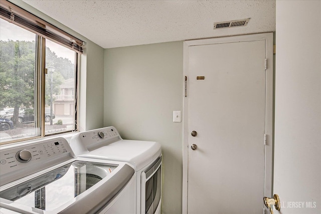 68 Kelly Dr, Edison, NJ 08820 - laundry area with washer and dryer and a textured ceiling