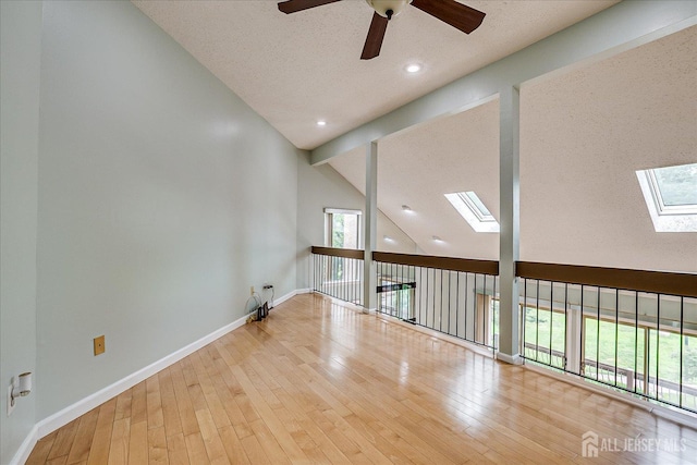 68 Kelly Dr, Edison, NJ 08820 - unfurnished room featuring a skylight, a ceiling fan, hardwood / wood-style flooring, beam ceiling, and recessed lighting