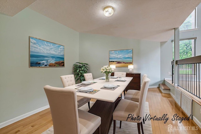 68 Kelly Dr, Edison, NJ 08820 - dining space featuring light wood finished floors and a textured ceiling