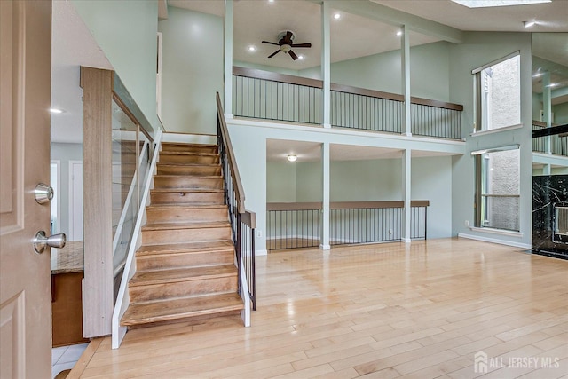 68 Kelly Dr, Edison, NJ 08820 - staircase featuring wood finished floors, ceiling fan, beamed ceiling, high vaulted ceiling, and recessed lighting