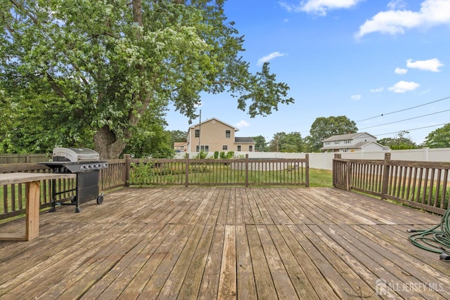 31 Brunswick Dr, Howell, NJ 07731 - wooden deck with a fenced backyard and grilling area