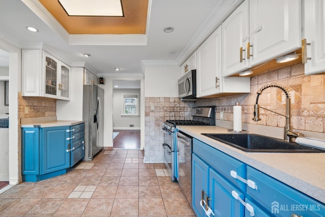 31 Brunswick Dr, Howell, NJ 07731 - kitchen featuring blue cabinetry, stainless steel appliances, white cabinetry, ornamental molding, and light countertops