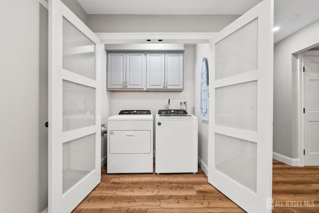 31 Brunswick Dr, Howell, NJ 07731 - laundry room with cabinet space, independent washer and dryer, and light wood-style floors