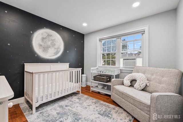 31 Brunswick Dr, Howell, NJ 07731 - bedroom featuring cooling unit, wood finished floors, recessed lighting, and a nursery area