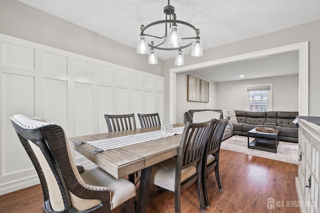 31 Brunswick Dr, Howell, NJ 07731 - dining area with a chandelier, dark wood-type flooring, and a decorative wall