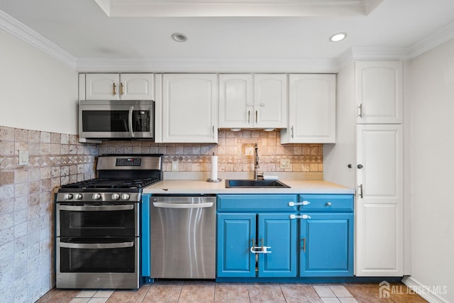 31 Brunswick Dr, Howell, NJ 07731 - kitchen featuring appliances with stainless steel finishes, blue cabinetry, ornamental molding, white cabinets, and light countertops