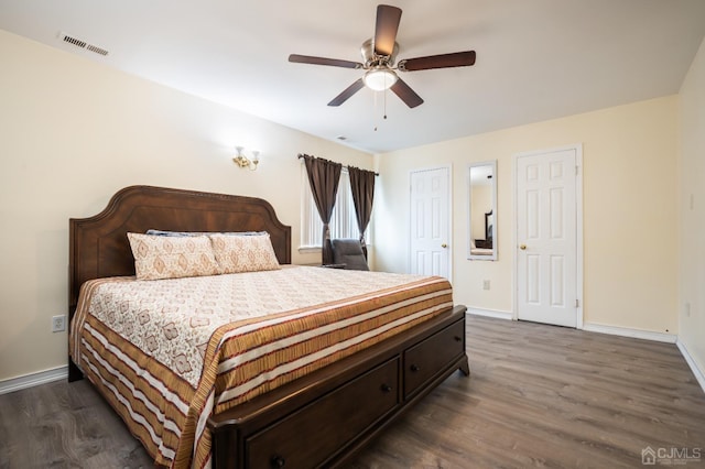 bedroom featuring ceiling fan and dark hardwood / wood-style floors