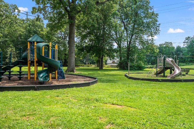 view of play area featuring a lawn