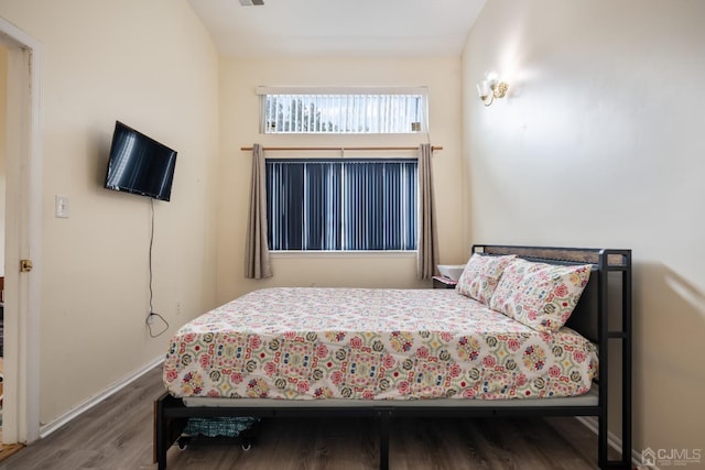 bedroom featuring wood-type flooring