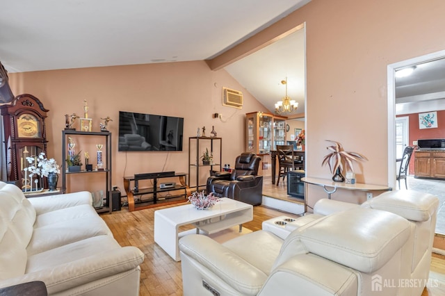 living area featuring vaulted ceiling with beams, light wood-style floors, a chandelier, and a wall mounted AC