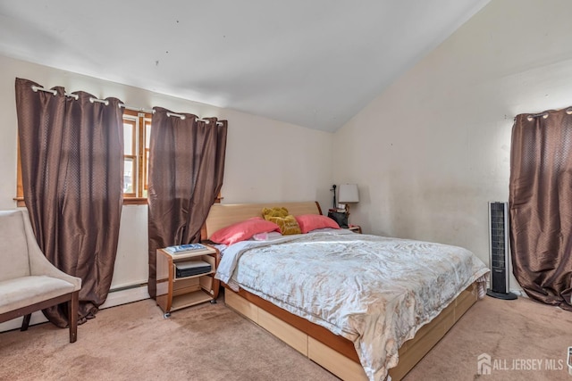 bedroom with baseboard heating, light colored carpet, and vaulted ceiling