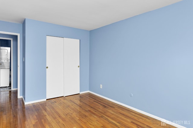 1724 Country Mill Dr, East Windsor, NJ 08512 - unfurnished bedroom featuring baseboards, hardwood / wood-style floors, and a closet