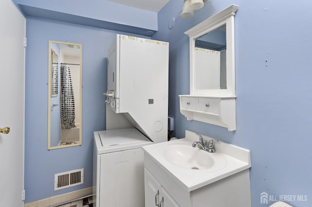 1724 Country Mill Dr, East Windsor, NJ 08512 - bathroom with stacked washer and clothes dryer and vanity