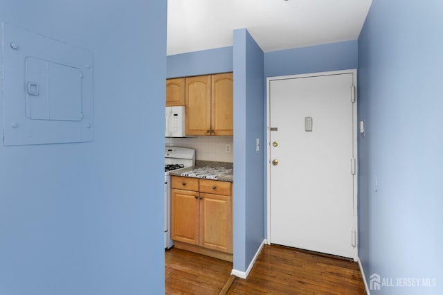 1724 Country Mill Dr, East Windsor, NJ 08512 - kitchen featuring white appliances, wood finished floors, electric panel, tasteful backsplash, and light stone countertops