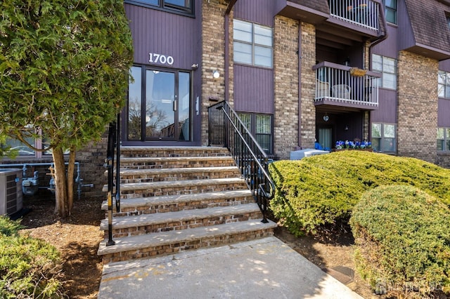 1724 Country Mill Dr, East Windsor, NJ 08512 - doorway to property with brick siding and central air condition unit