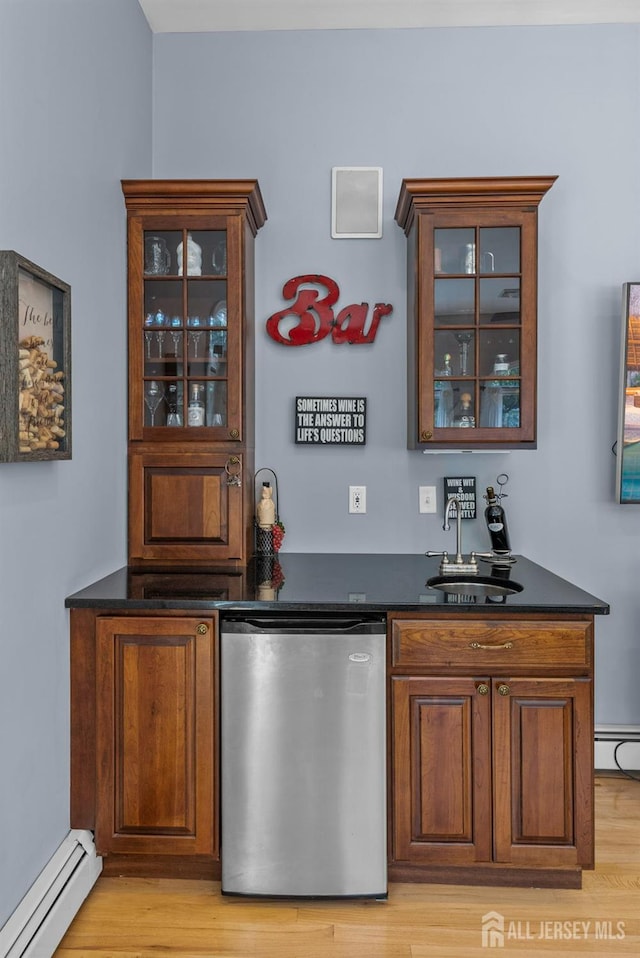 8 Garvey Dr, Monroe, NJ 08831 - indoor wet bar featuring baseboard heating, dishwasher, light wood-type flooring, and a baseboard heating unit