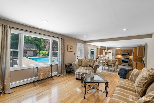 8 Garvey Dr, Monroe, NJ 08831 - living area featuring a chandelier, healthy amount of natural light, light wood-style flooring, and recessed lighting