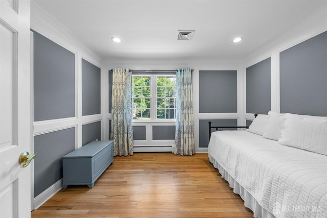 8 Garvey Dr, Monroe, NJ 08831 - bedroom with light wood-type flooring, baseboard heating, recessed lighting, and crown molding