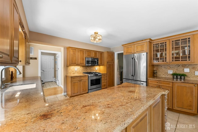 8 Garvey Dr, Monroe, NJ 08831 - kitchen featuring stainless steel appliances, light tile patterned flooring, light stone countertops, and backsplash