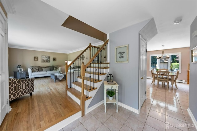 8 Garvey Dr, Monroe, NJ 08831 - stairway featuring a chandelier, tile patterned flooring, and ornamental molding