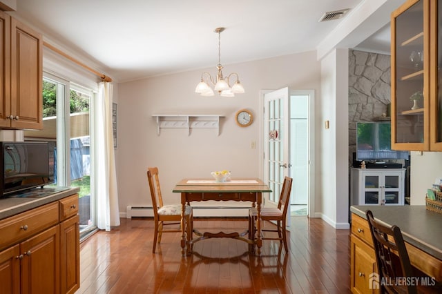 95 Half Acre Rd, Monroe, NJ 08831 - dining area with hardwood / wood-style floors, a chandelier, crown molding, a baseboard radiator, and baseboards
