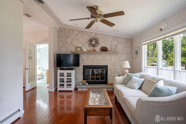95 Half Acre Rd, Monroe, NJ 08831 - living area with a baseboard radiator, crown molding, a ceiling fan, wood-type flooring, and a fireplace