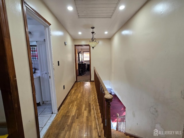 corridor with wood-type flooring