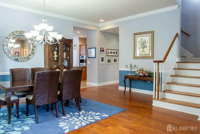 53 Mandrake Rd, Monroe, NJ 08831 - dining room featuring wood finished floors, stairs, a chandelier, ornamental molding, and baseboards