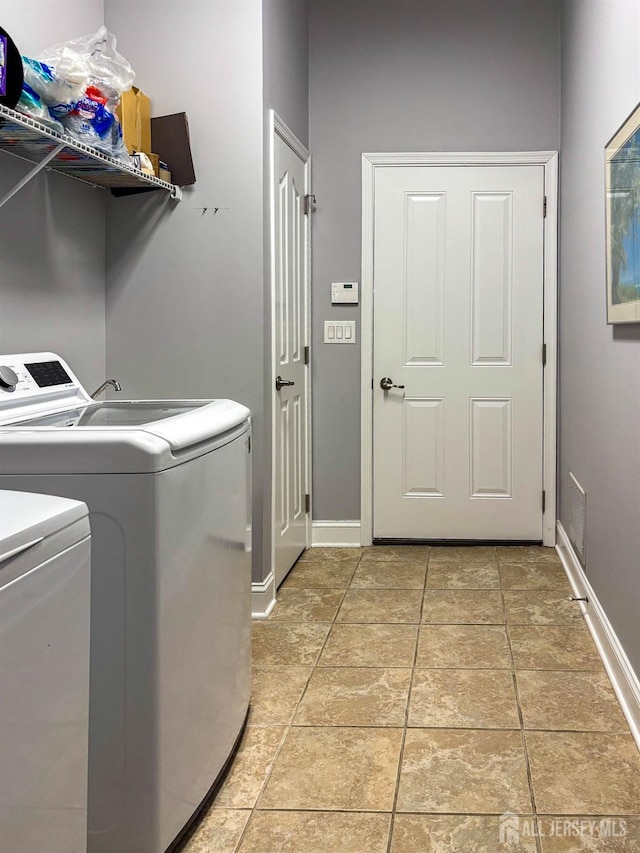 53 Mandrake Rd, Monroe, NJ 08831 - laundry room with washer and dryer and baseboards