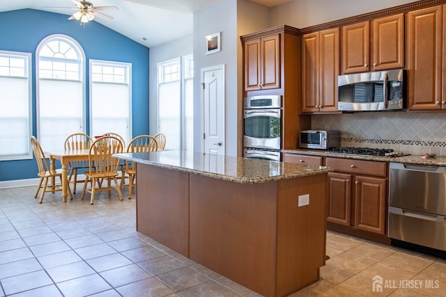 53 Mandrake Rd, Monroe, NJ 08831 - kitchen with appliances with stainless steel finishes, ceiling fan, stone counters, decorative backsplash, and lofted ceiling