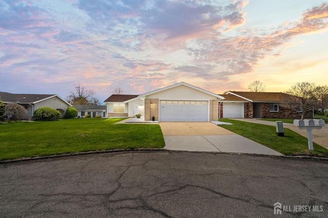 214 Branch Rd, Monroe, NJ 08831 - ranch-style home featuring a front lawn, driveway, a garage, and brick siding
