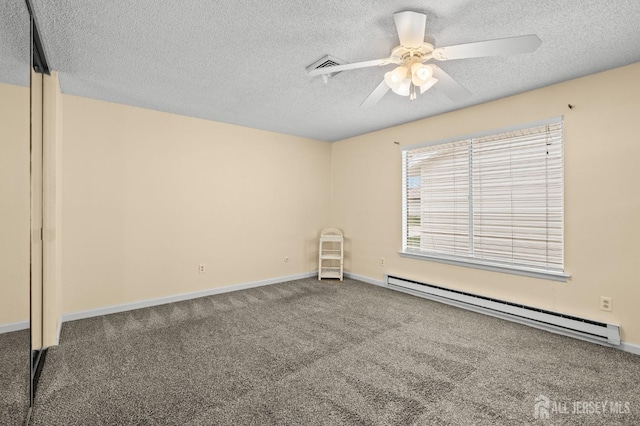 214 Branch Rd, Monroe, NJ 08831 - carpeted spare room with a baseboard radiator, a textured ceiling, ceiling fan, and baseboards