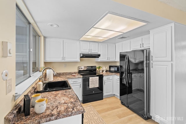 214 Branch Rd, Monroe, NJ 08831 - kitchen featuring black appliances, a sink, under cabinet range hood, and white cabinets