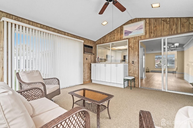 214 Branch Rd, Monroe, NJ 08831 - living room with wooden walls, lofted ceiling, ceiling fan, light carpet, and a chandelier