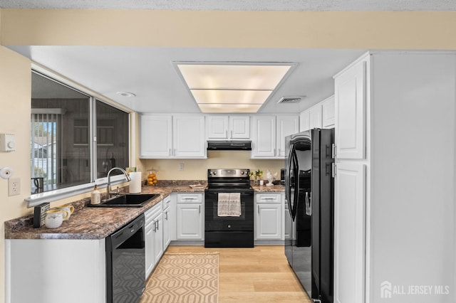 214 Branch Rd, Monroe, NJ 08831 - kitchen featuring black appliances, a sink, extractor fan, and white cabinetry