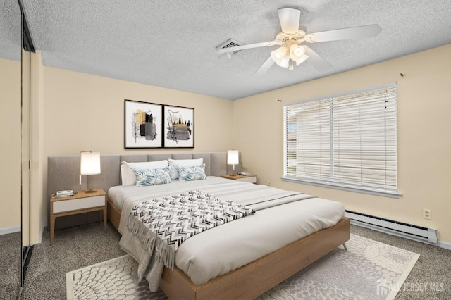 214 Branch Rd, Monroe, NJ 08831 - bedroom with a baseboard heating unit, carpet floors, a textured ceiling, and ceiling fan