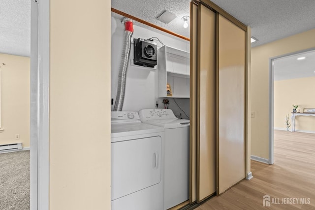 214 Branch Rd, Monroe, NJ 08831 - washroom with separate washer and dryer, a textured ceiling, light wood-style floors, baseboards, and a baseboard radiator