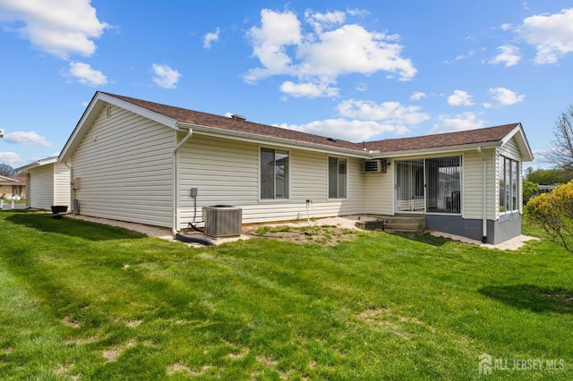214 Branch Rd, Monroe, NJ 08831 - rear view of house with central air condition unit and a yard