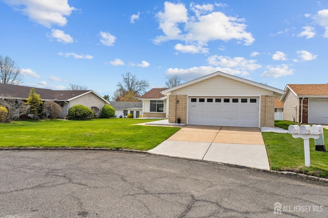 214 Branch Rd, Monroe, NJ 08831 - view of front of home with brick siding, a front lawn, and concrete driveway
