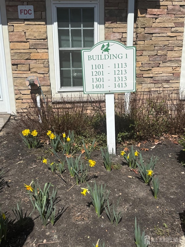 exterior details featuring stone siding