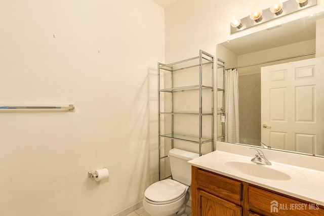 bathroom featuring vanity, a shower with curtain, and toilet