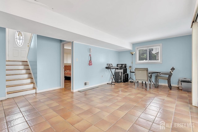 65 Curtis Ave, Piscataway, NJ 08854 - below grade area with stairs and light tile patterned floors