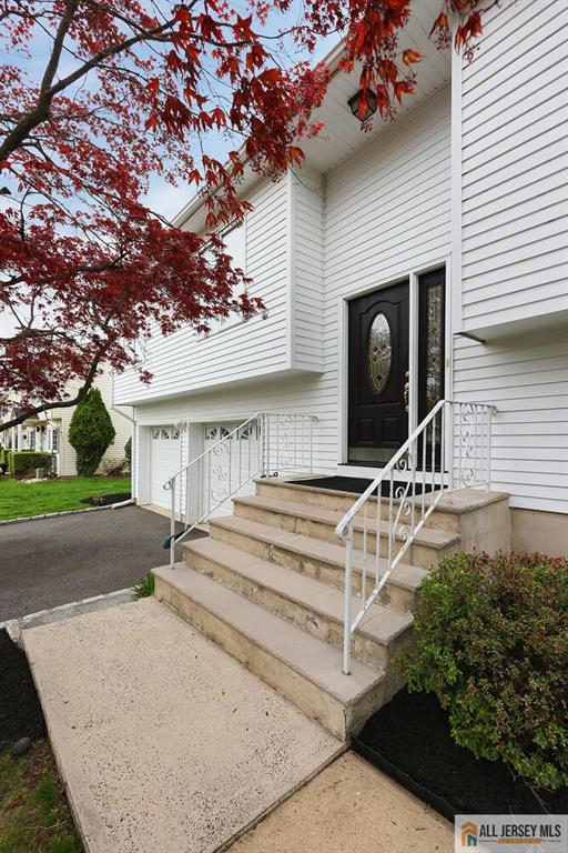 doorway to property with aphalt driveway