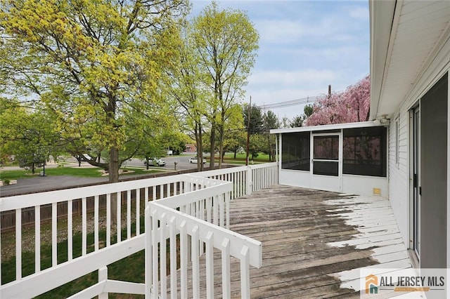 deck with a sunroom