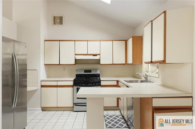 kitchen with a sink, a peninsula, stainless steel appliances, under cabinet range hood, and light countertops