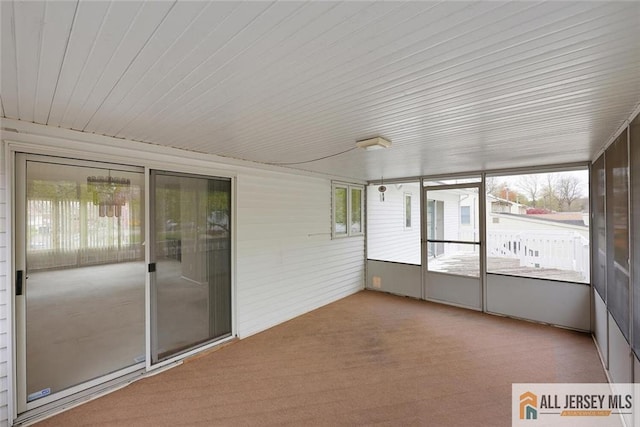 unfurnished sunroom featuring plenty of natural light