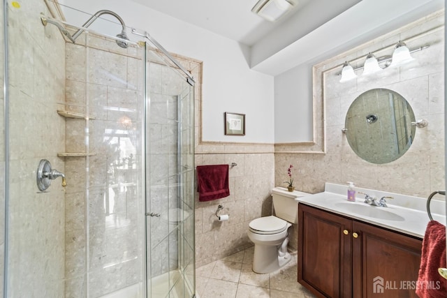 full bathroom with tile patterned flooring, toilet, tile walls, and a shower stall