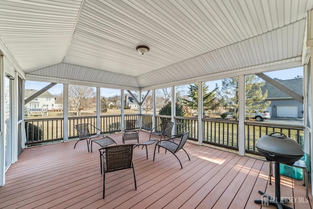 sunroom / solarium with lofted ceiling