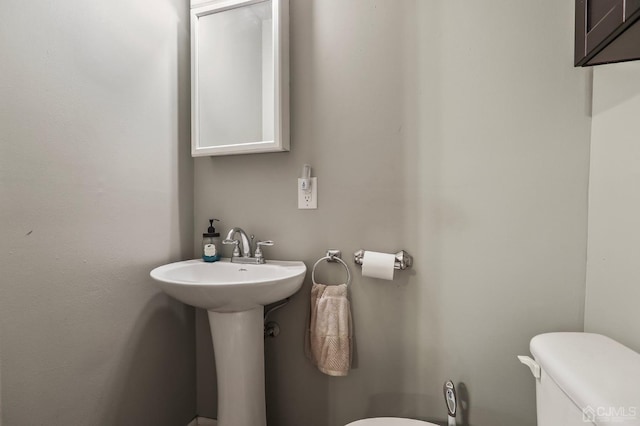 bathroom with a sink and toilet